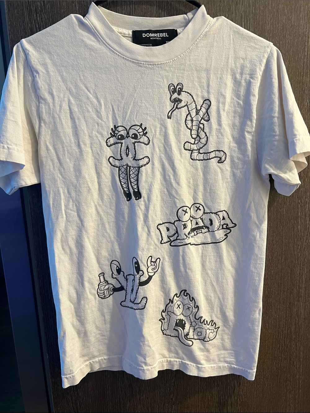 White Short-Sleeve Graphic Tee with Playful Black Illustrations
